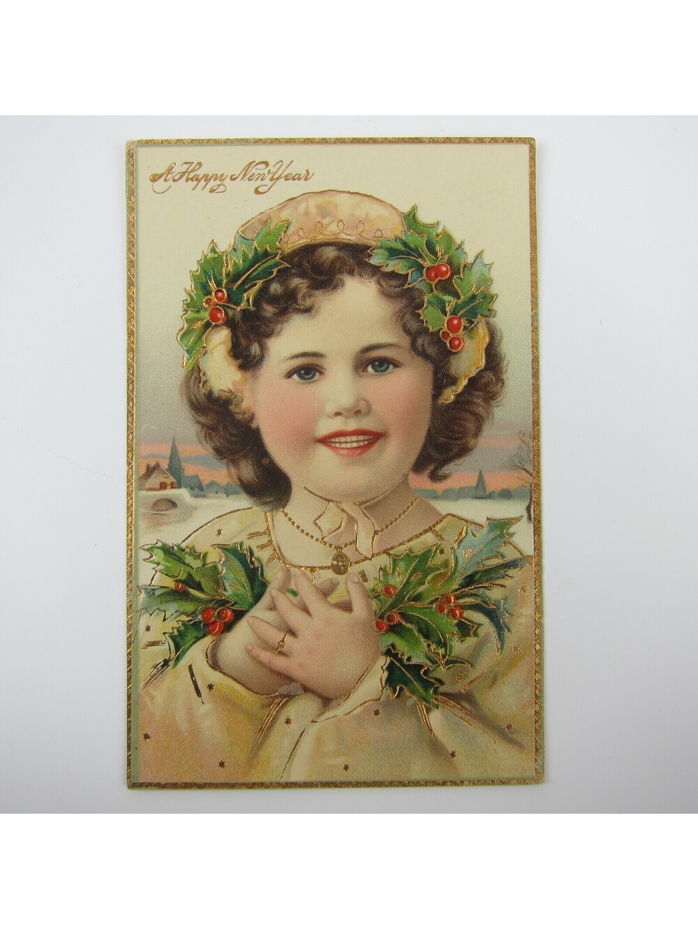 Postcard New Years Brunette Girl Blue Eyes Holly & Berries Gold Embossed Antique
